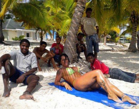White Wife Surrounded on Beach